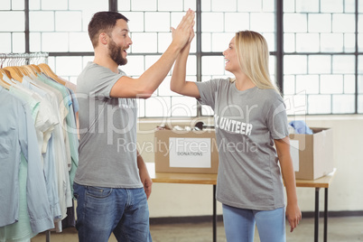 Happy volunteer doing high five