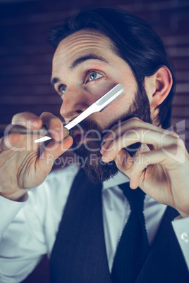 A man shaving his beard