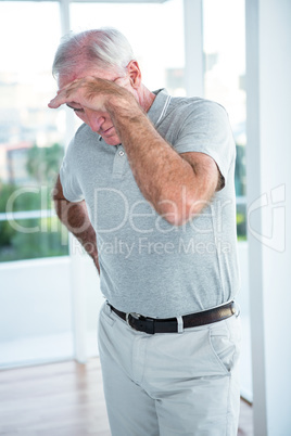 Mature depressed man standing