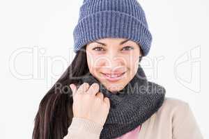 Attractive brunette looking at camera wearing warm clothes