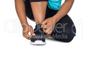 Woman tying her shoelace