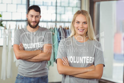 Portrait of smiling woman with colleague in office