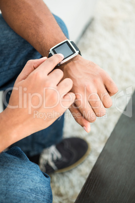 High angle view of man using smart watch