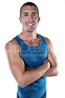 Smiling athlete with arms crossed