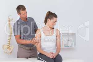 Doctor stretching woman arm