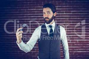 Portrait of man holding razor