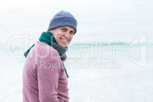 Smiling man wearing hat and scarf