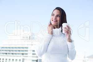 Beautiful brunette drinking a coffee