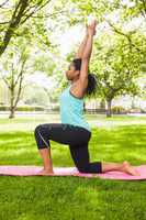 Young woman doing yoga on mat