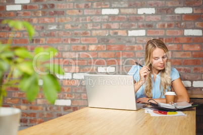 Woman working while sitting in office