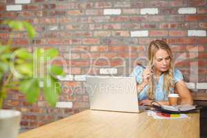 Woman working while sitting in office
