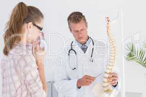 Doctor explaining the spine to his patient