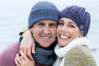 Smiling happy couple hugging each other