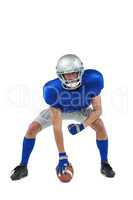 American football player in attack stance