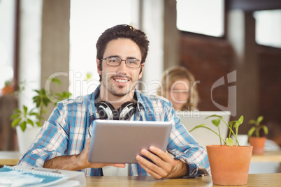 Portrait of happy businessman wearing eye glasses in creative of