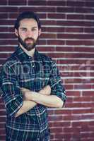 Portrait of confident hipster with arms crossed