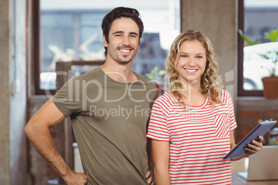 Portrait of joyful business people standing in office