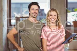 Portrait of joyful business people standing in office