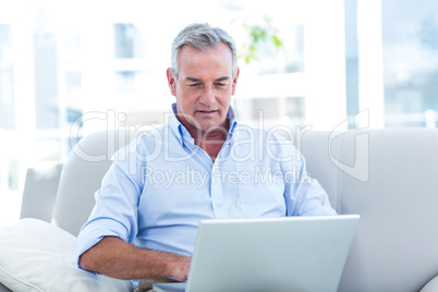 Man working on laptop at home