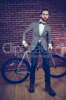 Portrait of stylish man with bicycle