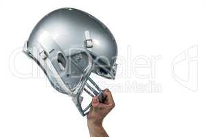 American football player handing his sliver helmet