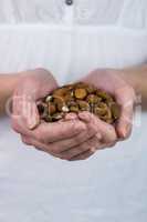 Woman showing handful of almonds