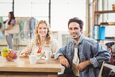 Portrait of smiling man and woman during coffee break