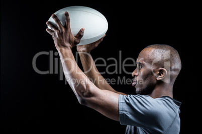 Athlete in position of throwing rugby ball