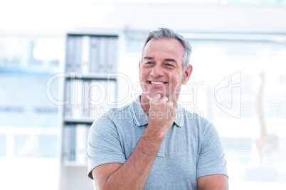 Smiling masseur in spa