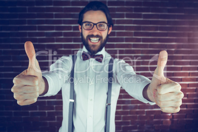 Portrait of excited man with thumbs up gesture