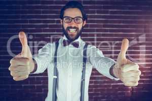 Portrait of excited man with thumbs up gesture