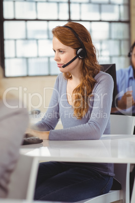 Concentrated female operator in office