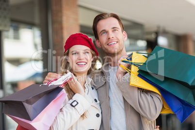 A happy couple with shopping bags