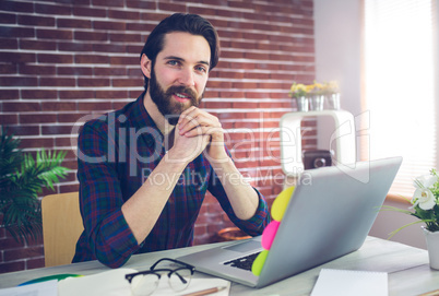 Portrait of creative editor with laptop