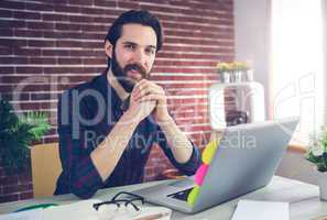 Portrait of creative editor with laptop