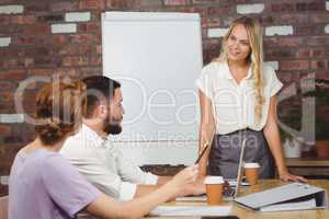 Businesswoman briefing over conference table
