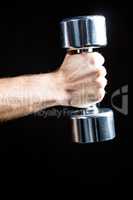 Close-up of of man working out with dumbbell