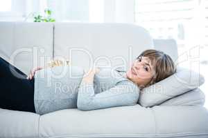 Portrait of pregnant woman playing with wooden blocks