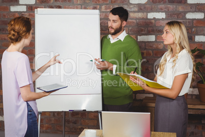 Businesswoman talking to colleagues