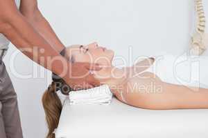 Woman receiving neck massage