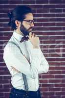 Side view of thoughtful man with hand on chin