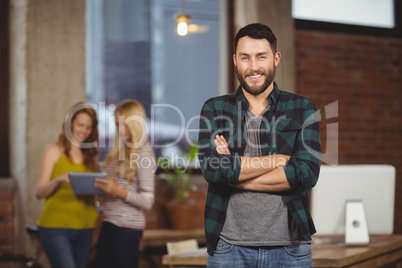 Portrait of smiling businessman standing in office Portrait of smiling businessman standing in office