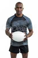 Portrait of confident sportsman holding rugby ball