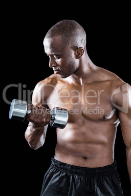 Athlete exercising with dumbbell