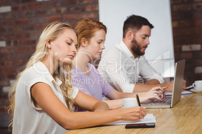 Business colleagues working in office