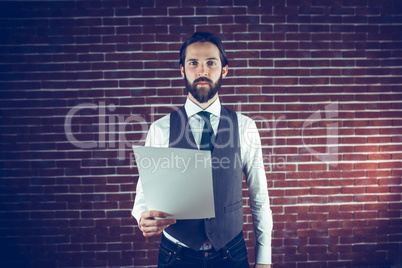 Portrait of confident man holding document