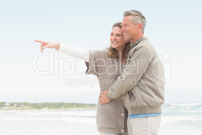 Smiling couple holding one another