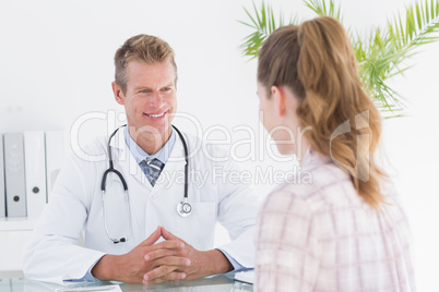 Happy doctor listening his patient