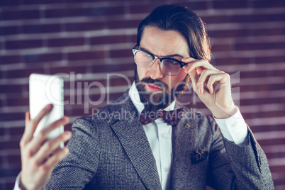 Fashionable man taking picture of himself