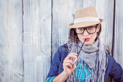 Happy hipster holding a paintbrush